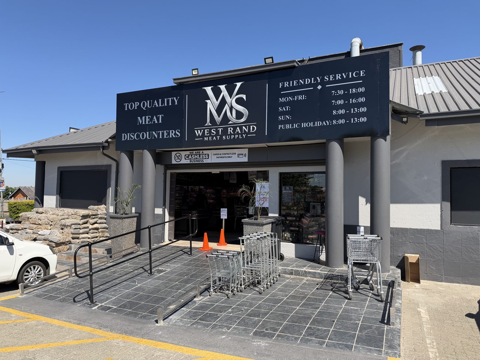 The West Rand Meat Supply shopfront in Florida Hills, with its black signboard and logo above the entrance